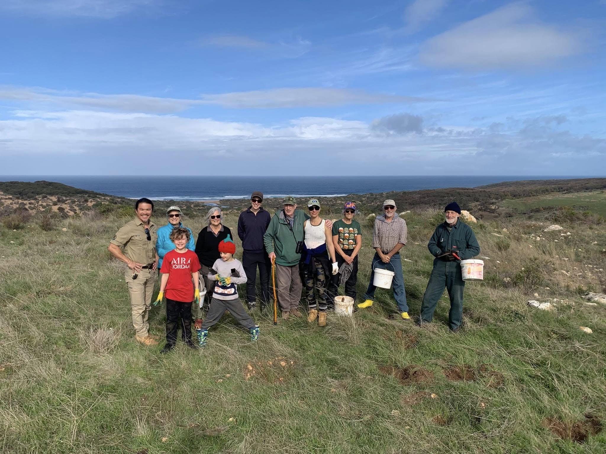 Friends of Newland Head Conservation Park on a planting day, working with local senior ranger Seiji