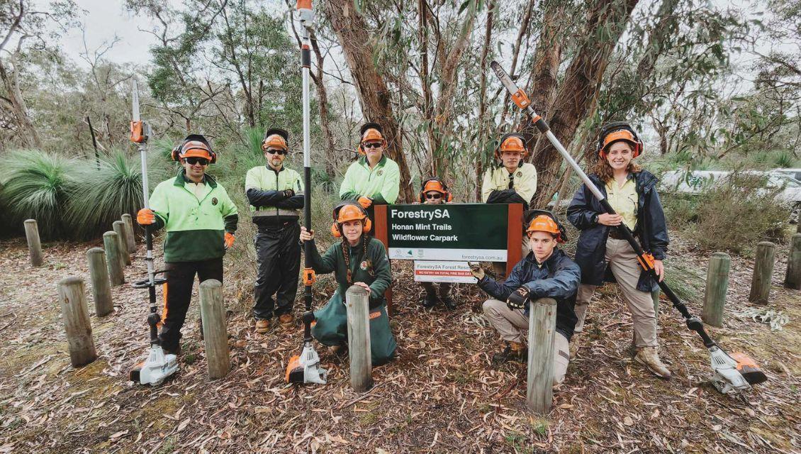 Emma Blythman, centre, and crew on park maintenance duty.