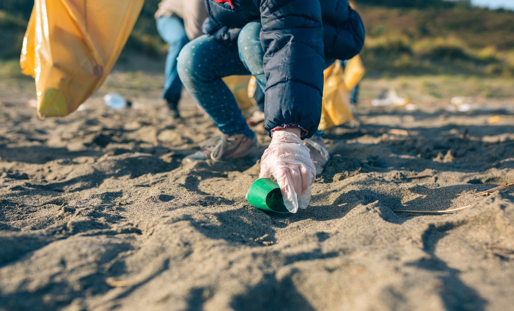 Cleaning up litter from the beach