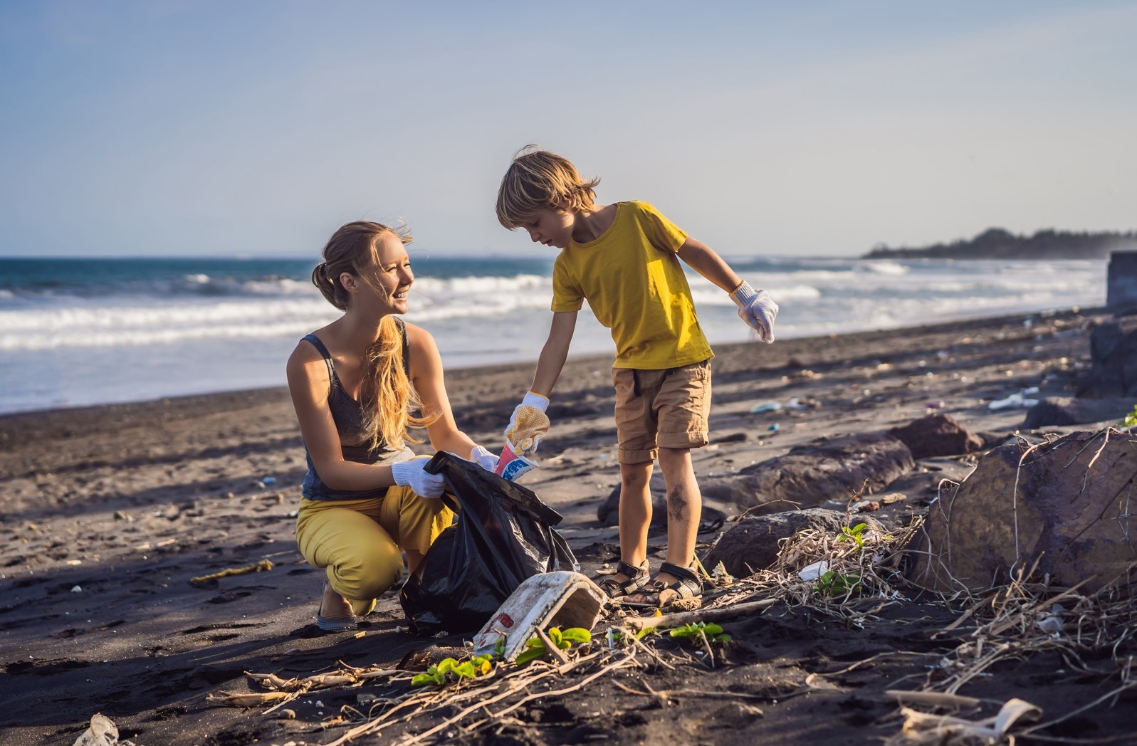 People cleaning up litter on a beach