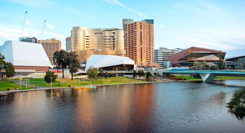 A photo of Torrens Lake with the riverbank precinct and tall buidlings in the background