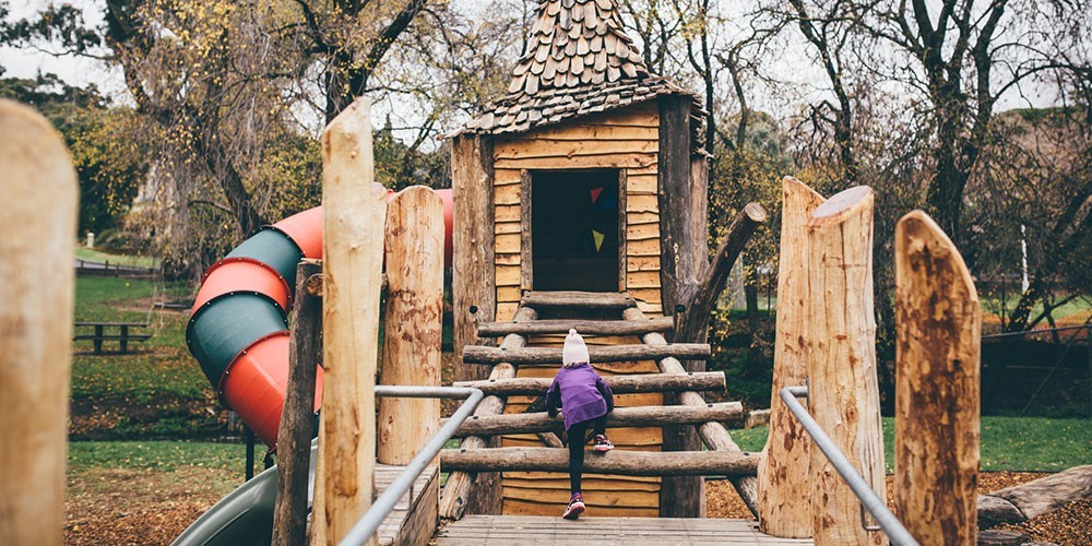 Child playing on a nature playground.